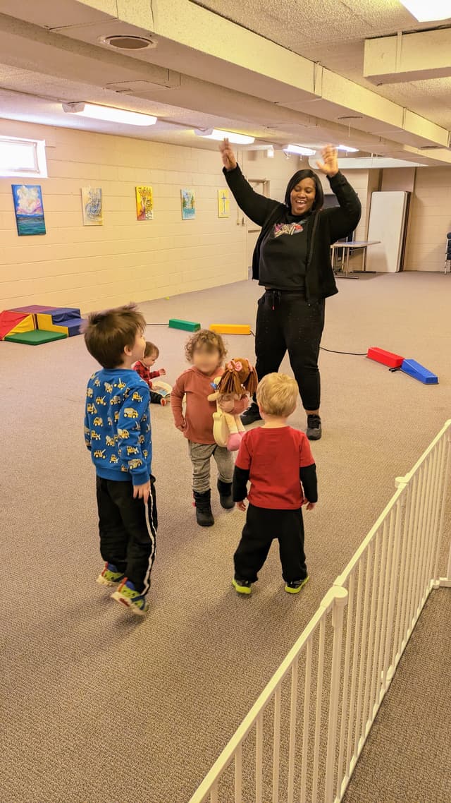 SkyWater Church kids leader dancing with the kids in toddler class